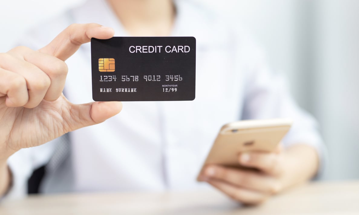 Woman Hands Holding Credit Card for Mobile Payment